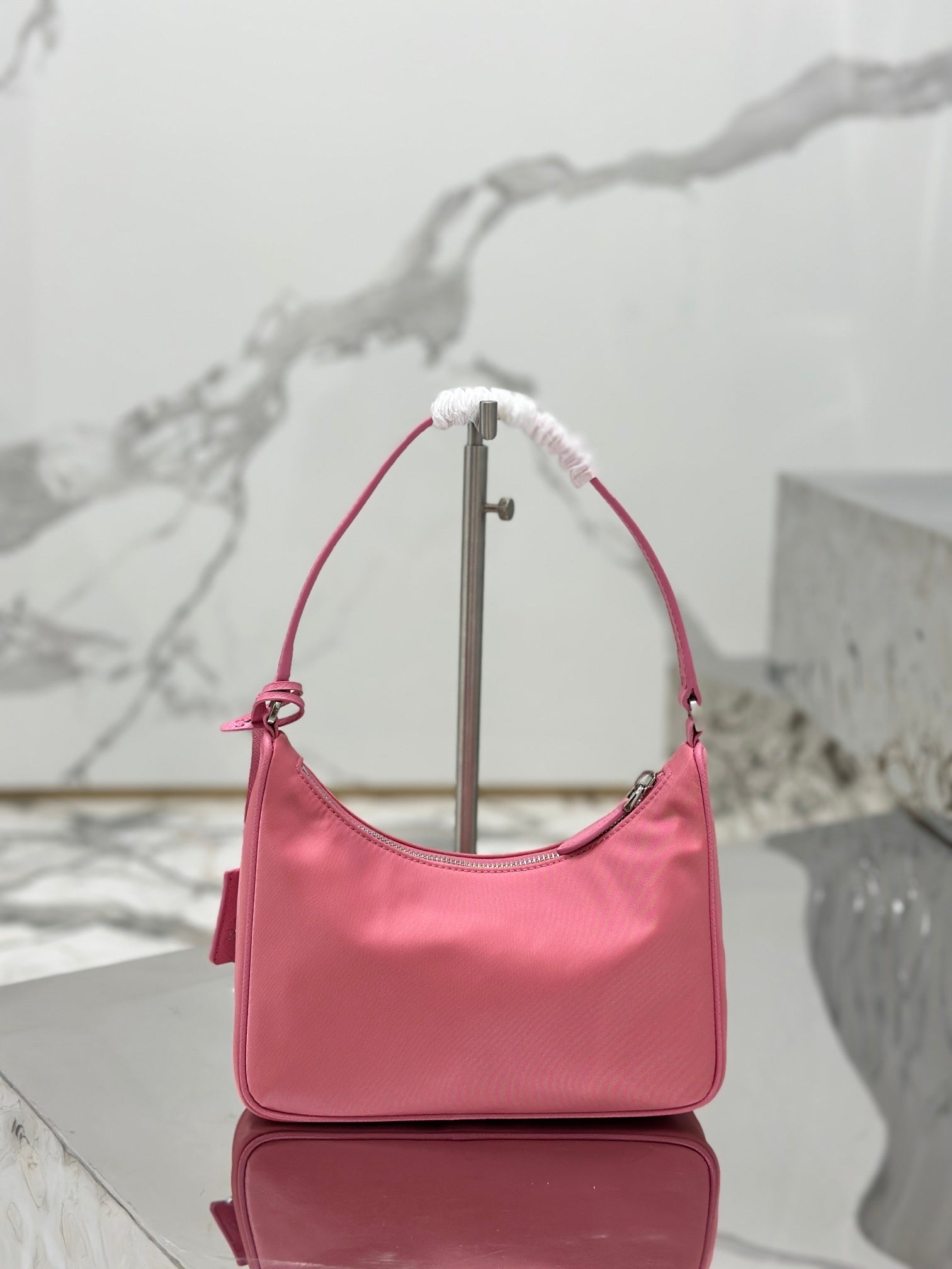 Bolsa Prada mini Re-Edition 2000